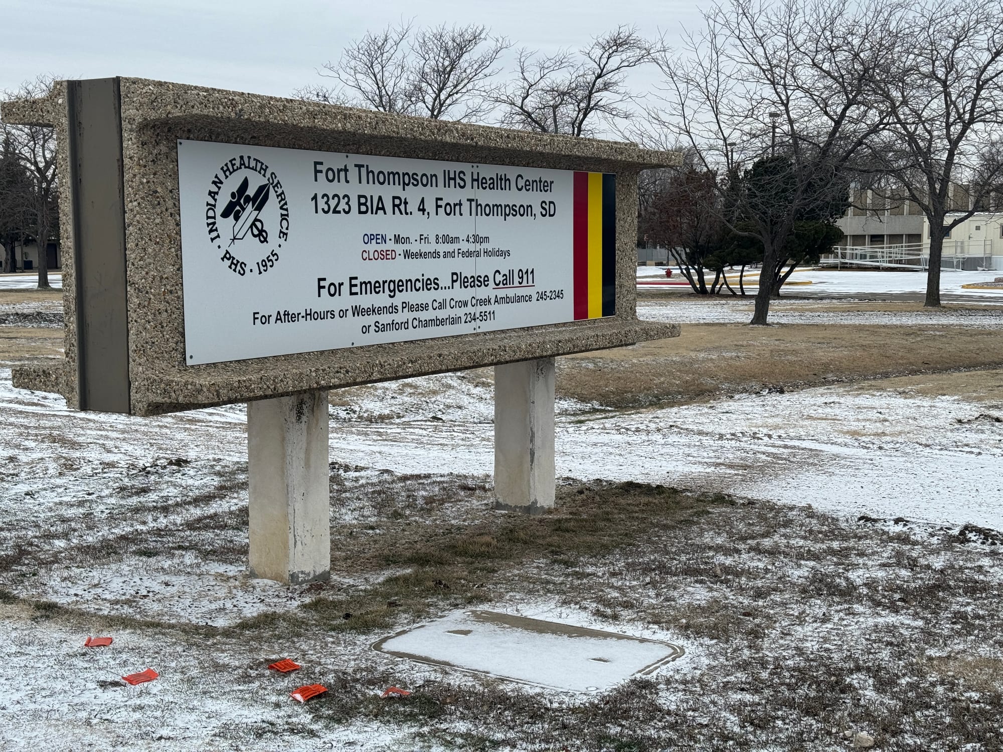 This sign outside the Indian Health Services clinic on March 23, 2024, in Fort Thompson, S.D., instructs people with health care needs beyond its weekday service hours to call 911 or an ambulance service for assistance. 