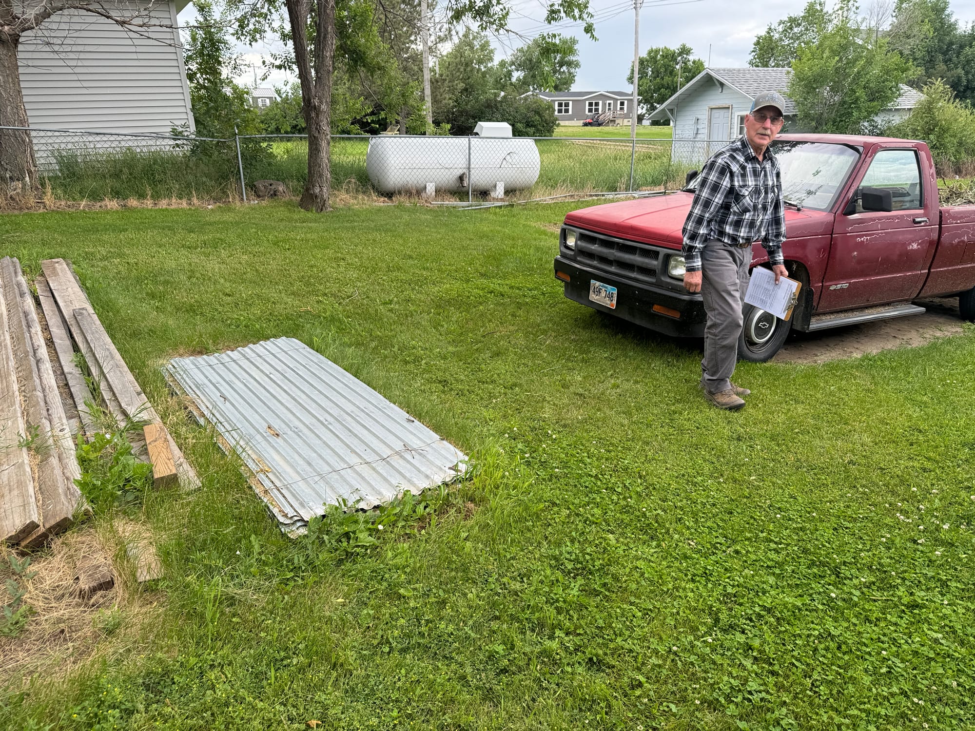 Faith, South Dakota, resident Dan Nolan walks through his back yard on July 2, 2024. 