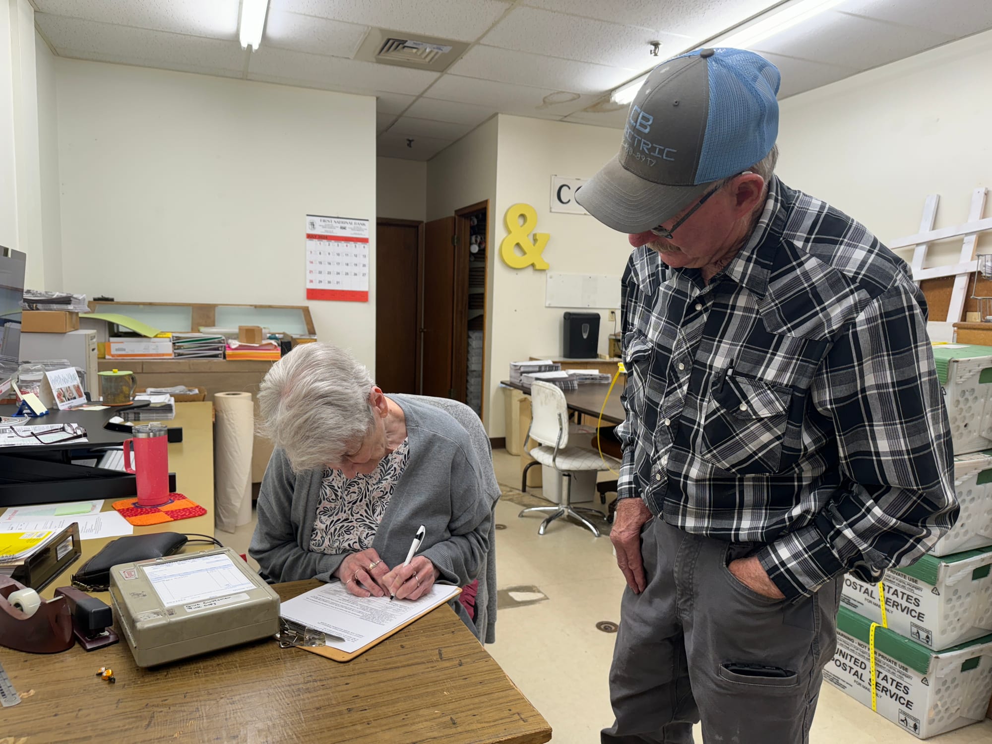 Faith, S.D., resident Loretta Passolt signs a petition being circulated on July 2, 2024