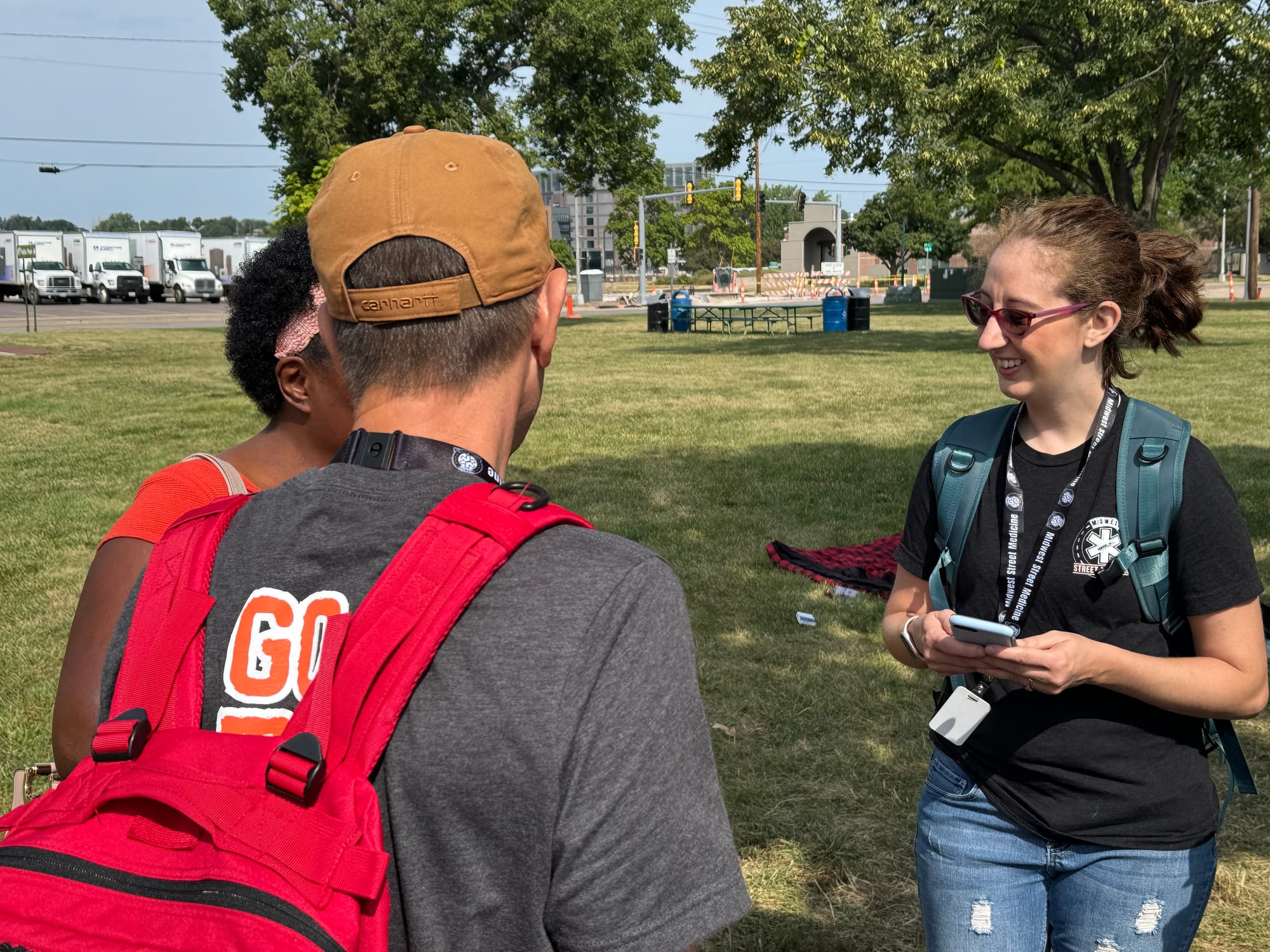 A medical professional speaks with a homeless person while giving her medical care in Sioux Falls, South Dakota.