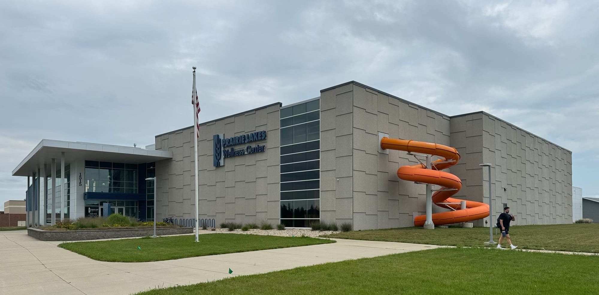 The exterior of the Prairie Lakes Wellness Center with a water slide on the outside in Watertown, South Dakota.