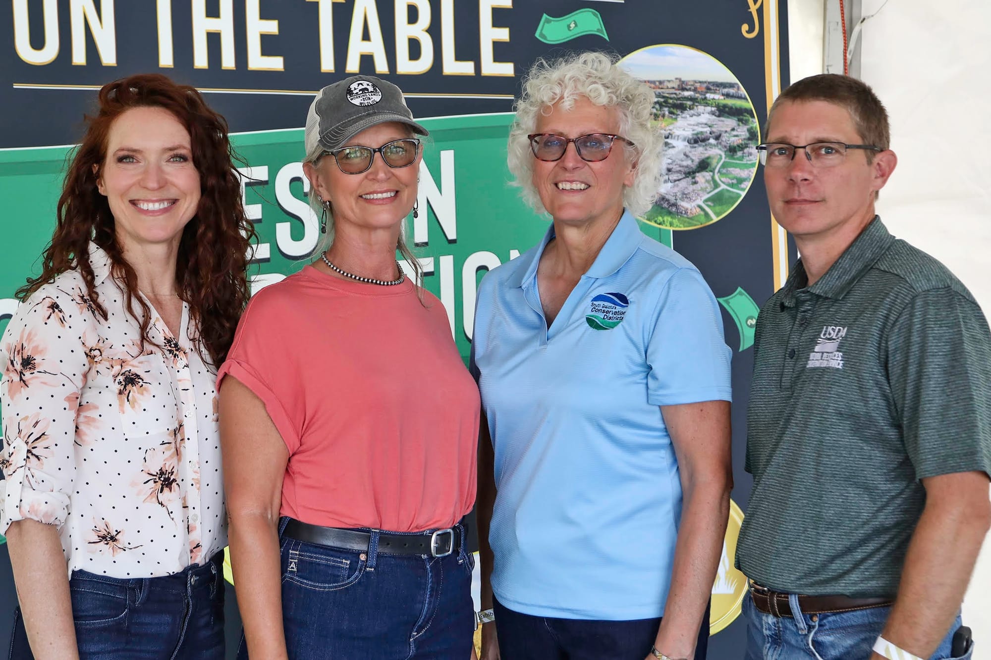 Project team Rebecca Blue, Colette Kessler, Angela Ehlers and Darrel DuVall pose for a photo on Aug. 22, 2024, at Dakotafest in Mitchell, S.D. 