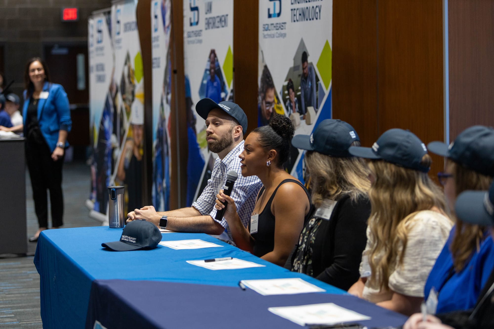 Students at Southeast Technical College in Sioux Falls, S.D., sign their Build Dakota Scholarship letters of intent at the school's annual signing day ceremony on June 7, 2024. 