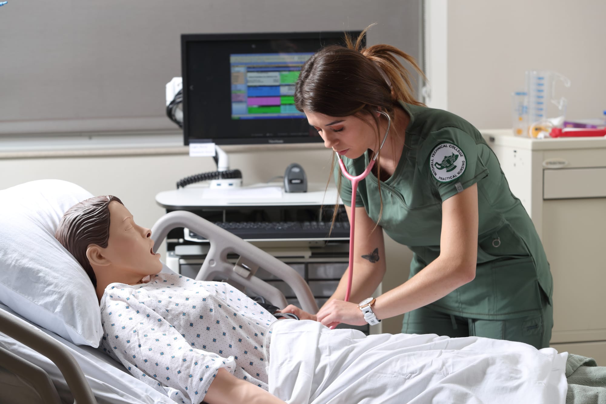 A nursing student works on a