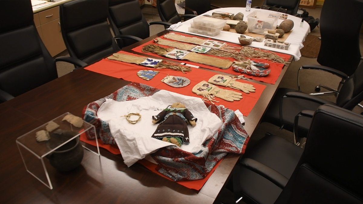 Historic artifacts sit on a table in the Sisseton Wahpeton Oyate's historic preservation office in Agency Village, S.D.