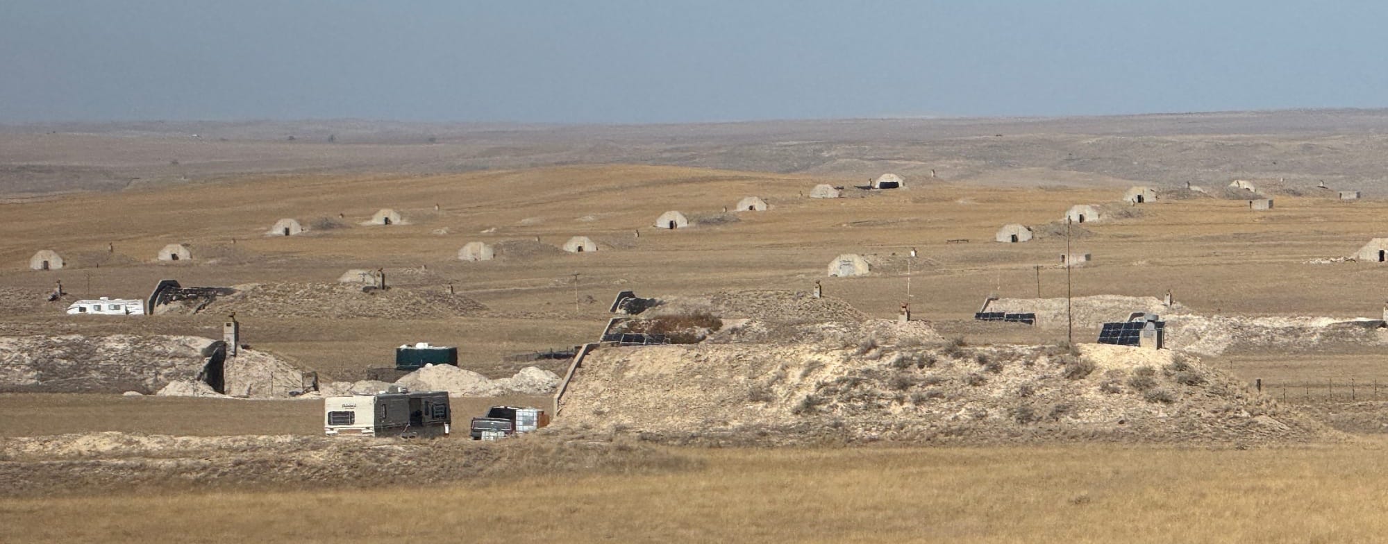 A bunker being used as a residence, in foreground, is part of the Vivos xPoint bunker 