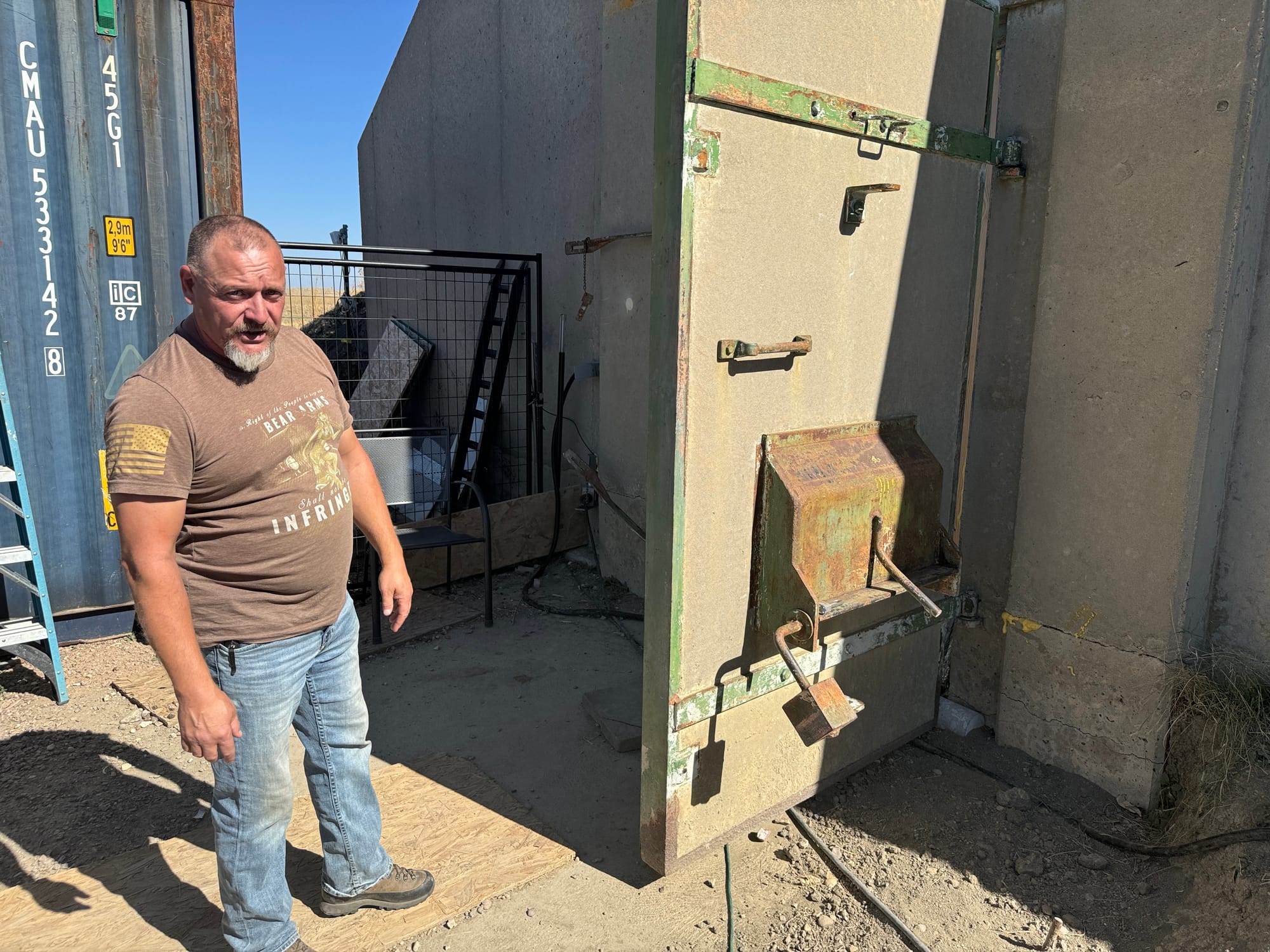 David Streeter stands outside the entrance to his bunker in southwestern South Dakota.