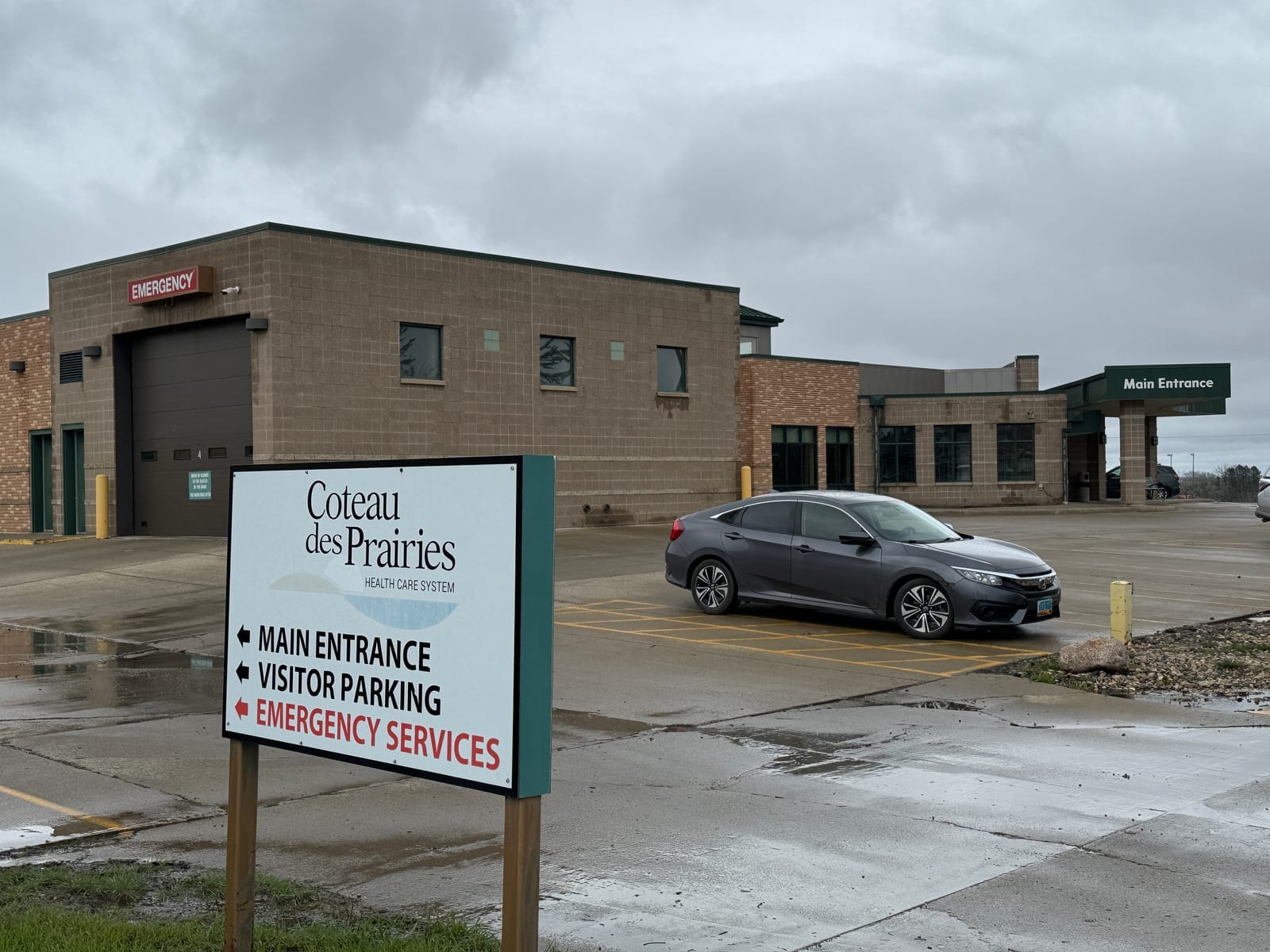 A vehicle is shown in the parking lot of Coteau des Prairies 