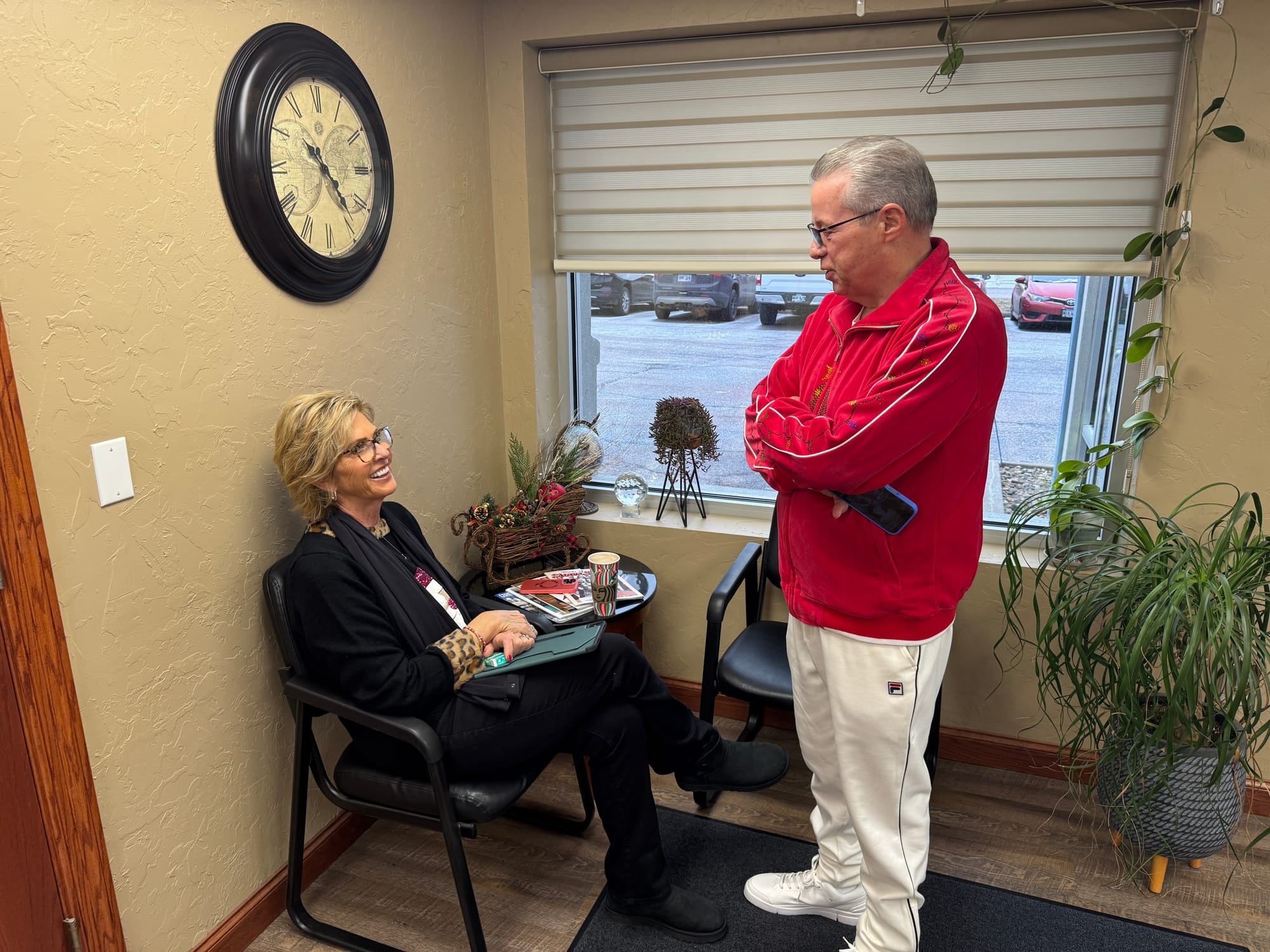 Greg Sands talks with his wife, Pam, at Sands Wall Systems in Tea, S.D.,