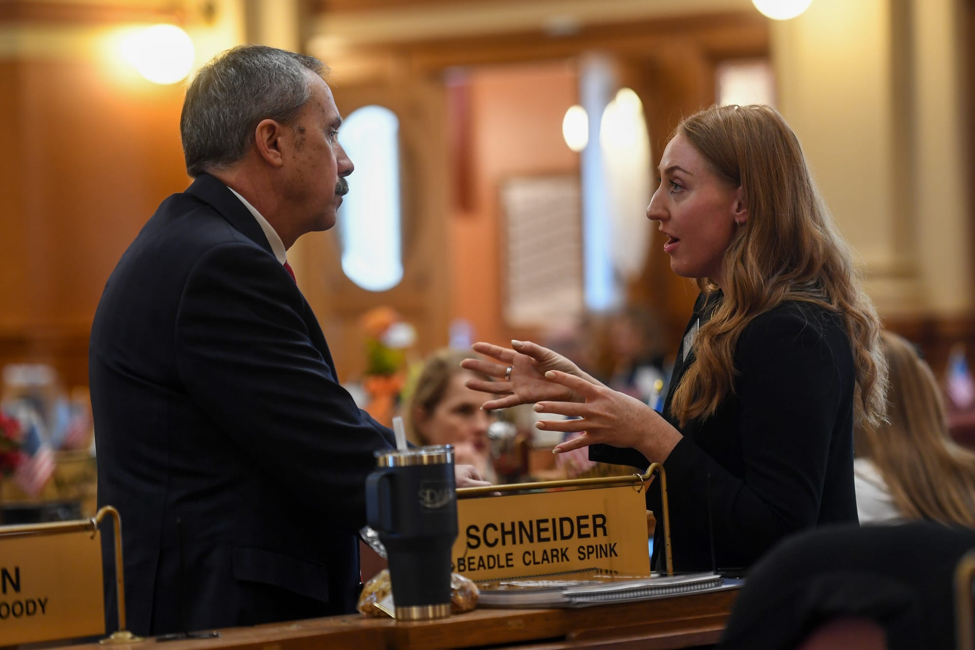 Two legislators involved in a conversation in Pierre, South Dakota