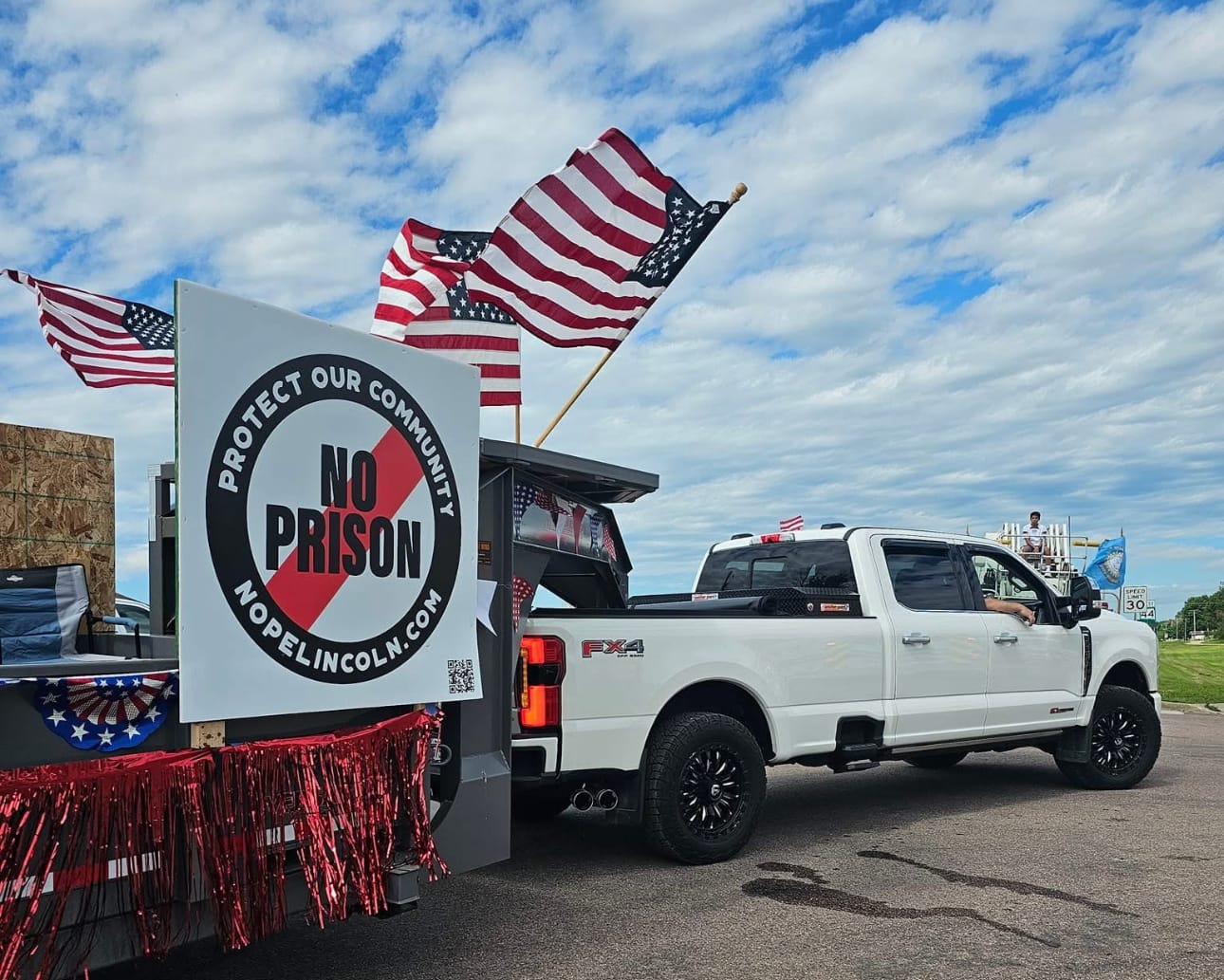 the NOPE banner is shown being pulled by a truck