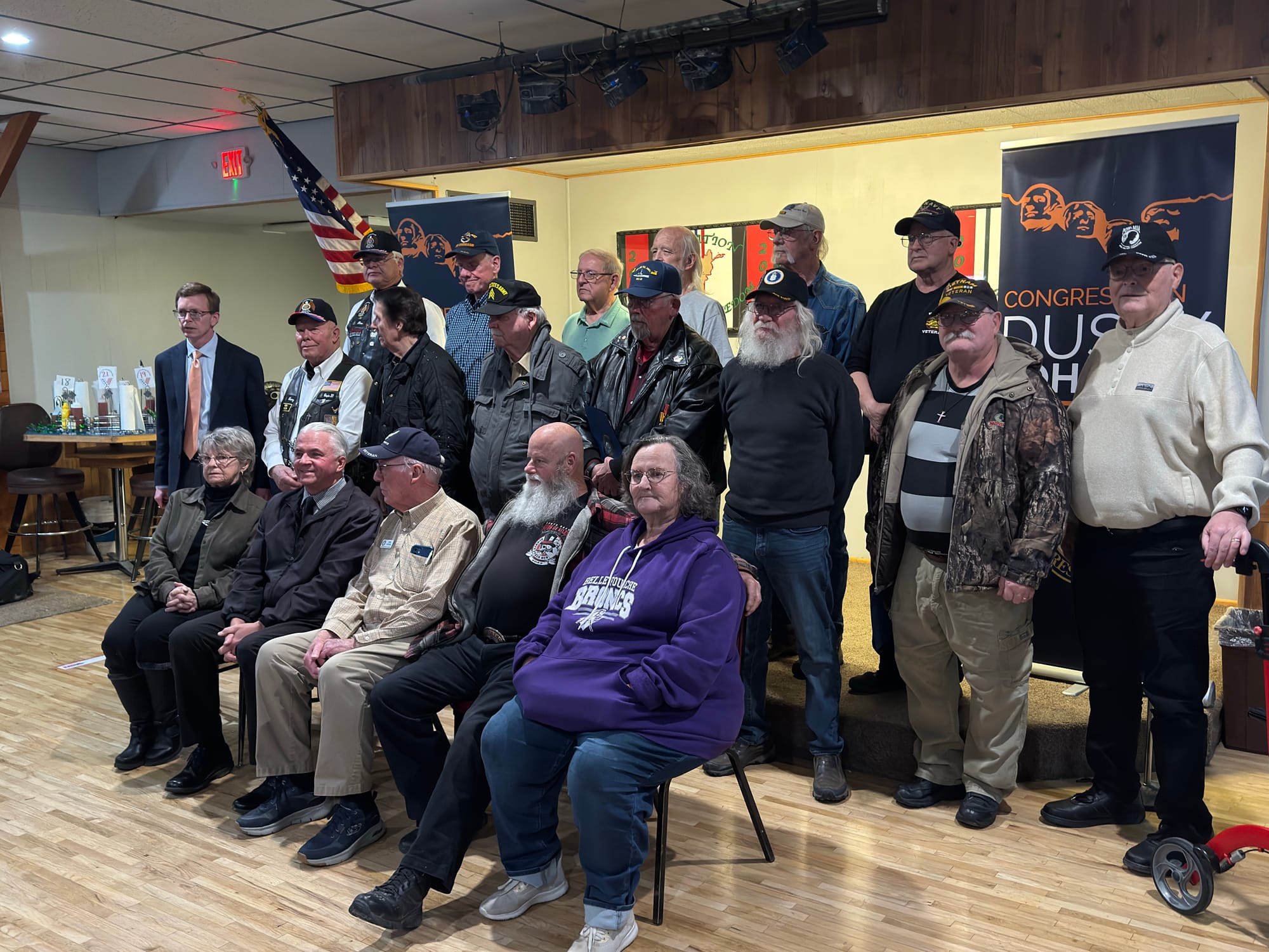 U.S. Rep. Dusty Johnson, R-South Dakota, at far left, stands among a group of Vietnam veterans and family members