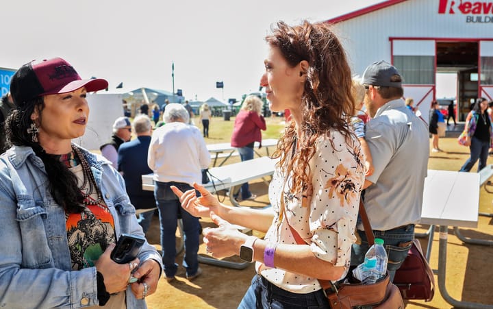 Two women talk at a Dakotafest event in Mitchell, South Dakota.