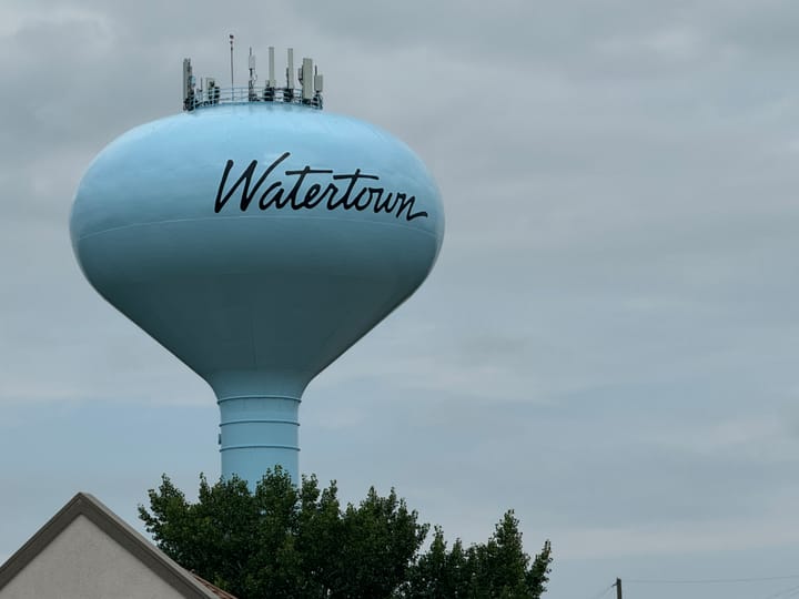 A blue watertower in the city of Watertown, South Dakota.