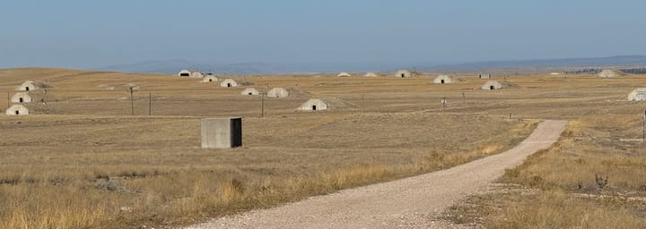 Above-ground bunkers are shown in a field in Igloo, South Dakota.